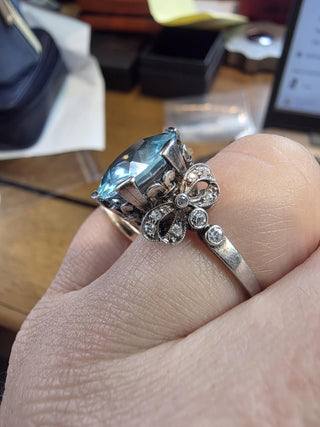 Antique Edwardian Platinum 7 Carat Blue Zircon Round Cut Ribbon Diamond Ring