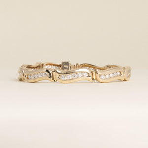 Vintage 1980s 14K Yellow Gold 1.80 Carat Diamond Channel-Set Wave Link Bracelet