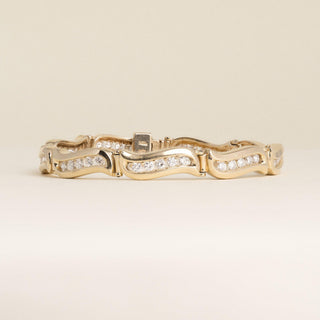Vintage 1980s 14K Yellow Gold 1.80 Carat Diamond Channel-Set Wave Link Bracelet