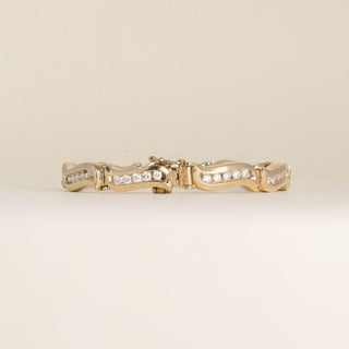 Vintage 1980s 14K Yellow Gold 1.80 Carat Diamond Channel-Set Wave Link Bracelet