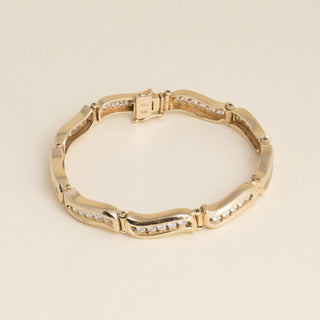 Vintage 1980s 14K Yellow Gold 1.80 Carat Diamond Channel-Set Wave Link Bracelet