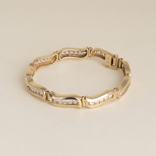 Vintage 1980s 14K Yellow Gold 1.80 Carat Diamond Channel-Set Wave Link Bracelet