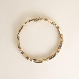 Vintage 1980s 14K Yellow Gold 1.80 Carat Diamond Channel-Set Wave Link Bracelet