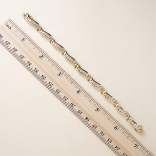 Vintage 1980s 14K Yellow Gold 1.80 Carat Diamond Channel-Set Wave Link Bracelet