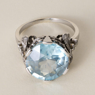 Antique Edwardian Platinum 7 Carat Blue Zircon Round Cut Ribbon Diamond Ring