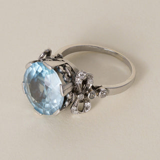 Antique Edwardian Platinum 7 Carat Blue Zircon Round Cut Ribbon Diamond Ring
